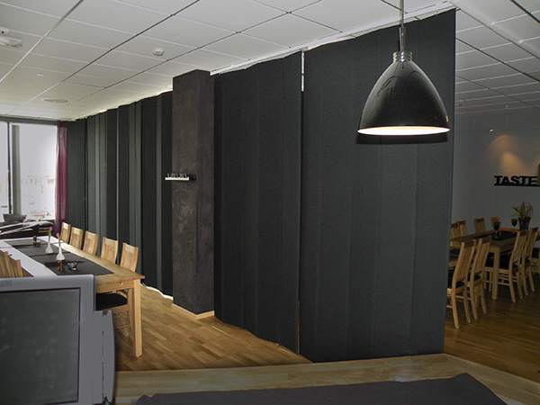 Black sound-insulating curtains in a restaurant