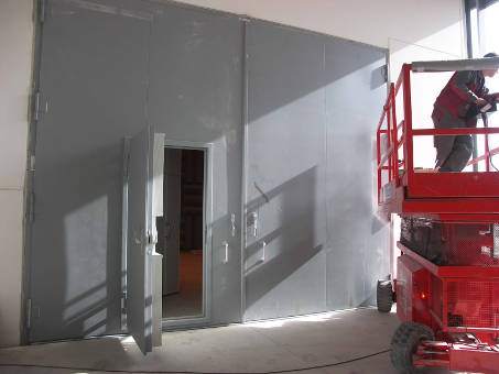 Large acoustic door with built-in soundproof door