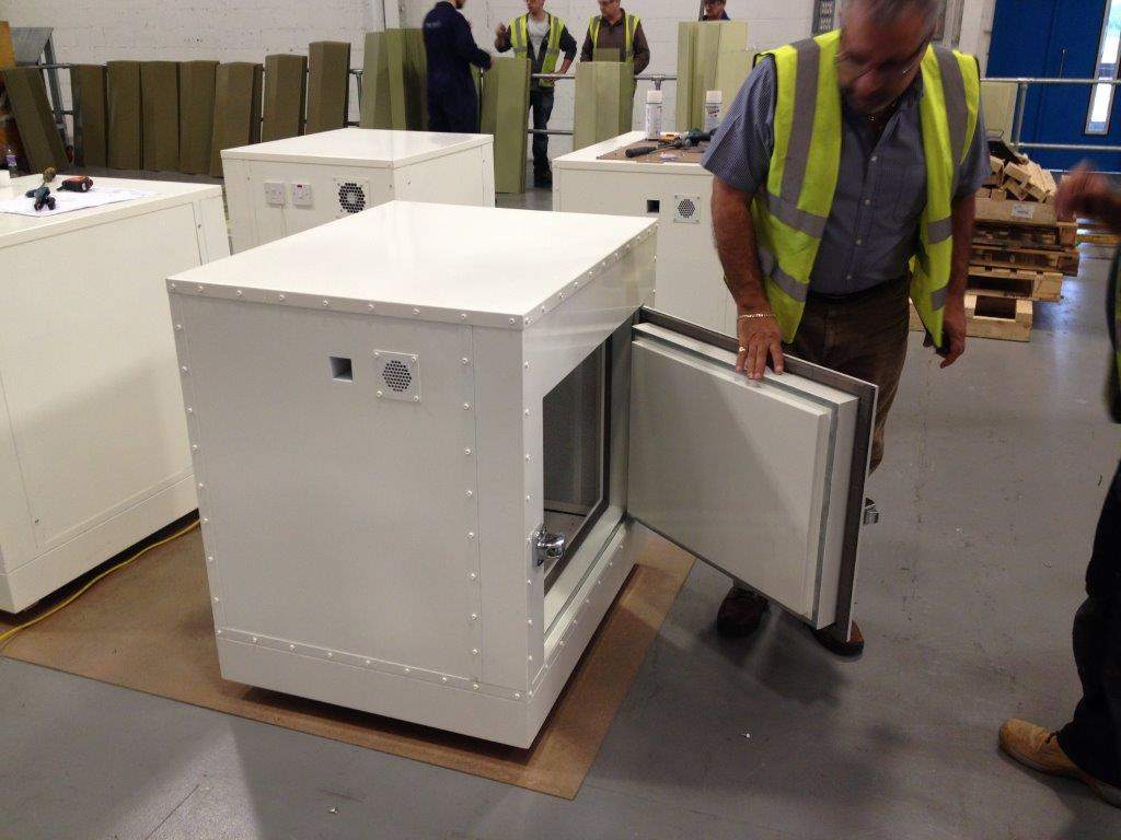 man opens mini anechoic chamber