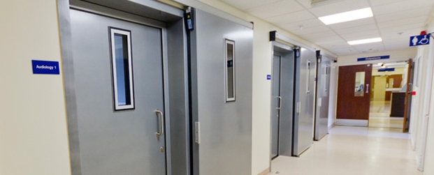 Soundproof swing door with an additional inserted soundproof sliding door in front of it